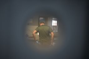 A guard in one of the Ukrainian prisons where Russian prisoners of war are held