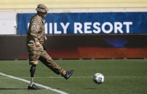 A military serviceman with a prosthesis on the field of the Arena-Lviv stadium