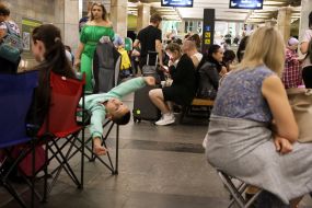 People hide from enemy rockets and mortars at one of the Kyiv metro stations