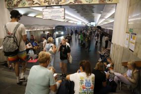 People hide from enemy rockets and mortars at one of the Kyiv metro stations