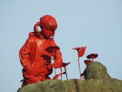Sculpture "Girl with Sunflowers" by artist James Colomin in Kyiv