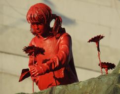 Sculpture "Girl with Sunflowers" by artist James Colomin in Kyiv