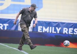 Military on the football field after the match