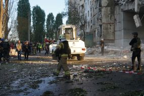 Rescuers are sorting through the rubble of a destroyed residential building in Kharkiv