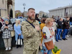 People honor the memory of the fallen Heroes with a moment of silence on Independence Square in Kyiv