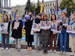 Relatives and friends of the fallen defenders with their portraits honor the memory of the fallen Heroes with a moment of silence on Independence Square in Kyiv