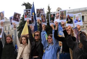 Relatives and friends of the fallen defenders with their portraits honor the memory of the fallen Heroes with a moment of silence on Independence Square in Kyiv