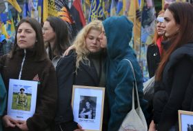 Women with portraits of fallen soldiers on Independence Square in Kyiv