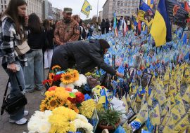 People honor the memory of the fallen Heroes with a moment of silence on Independence Square in Kyiv