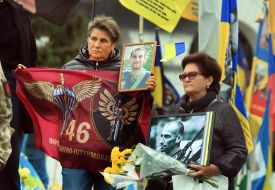 Women with portraits of fallen soldiers on Independence Square in Kyiv
