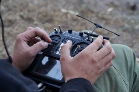 A fighter of the 57th brigade tests new drones before going on a mission at positions in the Kharkiv region