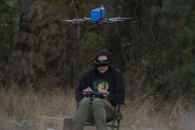 A fighter of the 57th brigade tests new drones before going on a mission at positions in the Kharkiv region