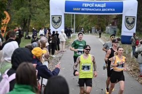 Participants of the "Day 963: Kyiv Marathon of Invincibility" charity race cover the distance on Trukhanovo Island in Kyiv