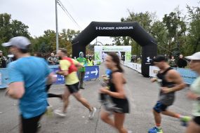 Participants of the "Day 963: Kyiv Marathon of Invincibility" charity race cover the distance on Trukhanovo Island in Kyiv