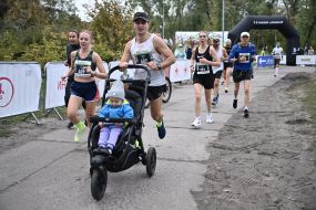 Participants of the "Day 963: Kyiv Marathon of Invincibility" charity race cover the distance on Trukhanovo Island in Kyiv