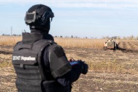 A mine clearing machine works in a field