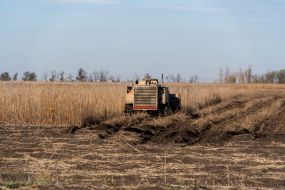 A mine clearing machine works in a field