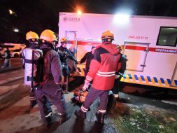 Rescuers work at the site of a drone strike in a residential building in Kyiv