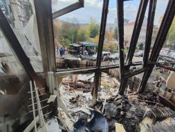 A window in a damaged apartment in Kyiv was broken after the debris of a downed drone fell