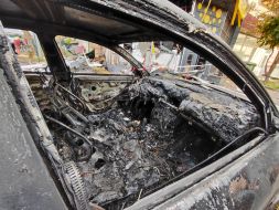 A car destroyed by falling debris of a downed drone in Kyiv