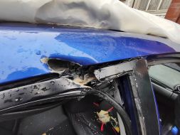 A car damaged by a shrapnel from a suicide bomber in the Sviatoshynskyi district of Kyiv