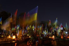 Candles lit on All Saints' Day at the graves of fallen servicemen at the Lychakiv Cemetery in Lviv