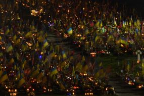 Candles lit on All Saints' Day at the graves of fallen servicemen at the Lychakiv Cemetery in Lviv