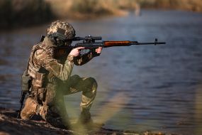 Military personnel train in covert movement skills