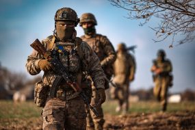 Military personnel train in covert movement skills