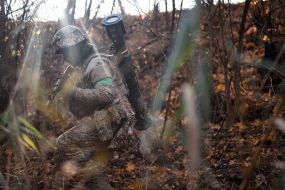 Military personnel train in covert movement skills