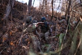 Military personnel train in covert movement skills