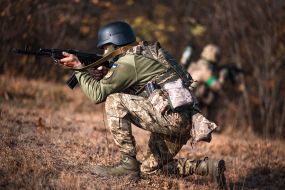 Military personnel train in covert movement skills