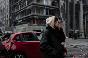 A girl at the site of the fall of the debris of a downed missile
