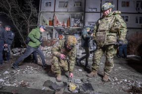 Investigators are collecting evidence of crimes committed by Russian occupiers next to a residential building in Kharkiv destroyed by a drone strike