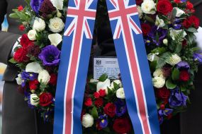 Soldiers of the honor guard company carry a wreath