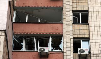 Broken windows in a residential building after a ballistics strike in the central district of Kyiv