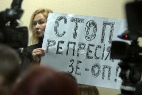 Civic activist holding a poster
