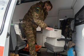 A battalion paramedic of the 13th brigade of the NSU "Charter" collects medicines for the evacuation of the wounded