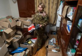 A battalion paramedic of the 13th brigade of the NSU "Charter" collects medicines for the evacuation of the wounded