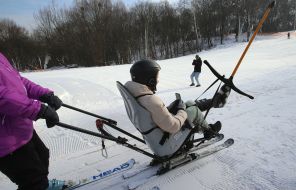 Veterans training on adaptive skiing