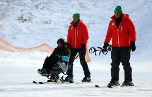 Veterans training on adaptive skiing