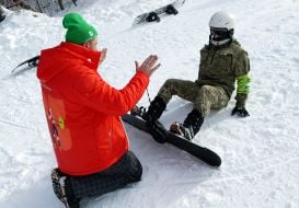 Veterans training on adaptive skiing