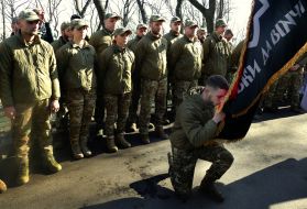 New recruits take the volunteer oath at the grave of Hero of Ukraine Dmytro Kotsiubayl "Da Vinci"
