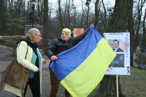 Activists wearing masks of Donald Trump and Vladimir Putin