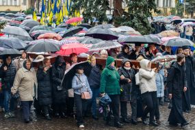 Women carry the Cross down the street in Uzhhorod