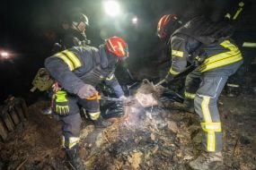 A rescuers during the elimination of the consequences of the arrival of one of the Russian Geran-2 strike drones