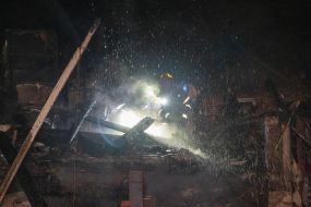 A rescuer puts out a fire at the arrival site of one of the Russian Geran-2 strike drones.