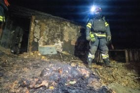 A rescuer during the elimination of the consequences of the arrival of one of the Russian Geran-2 strike drones