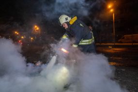 A rescuer puts out a fire at the arrival site of one of the Russian Geran-2 strike drones.