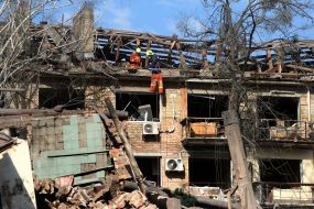 A collapsed roof and broken windows in a house next to the one hit by a rocket in Kyiv